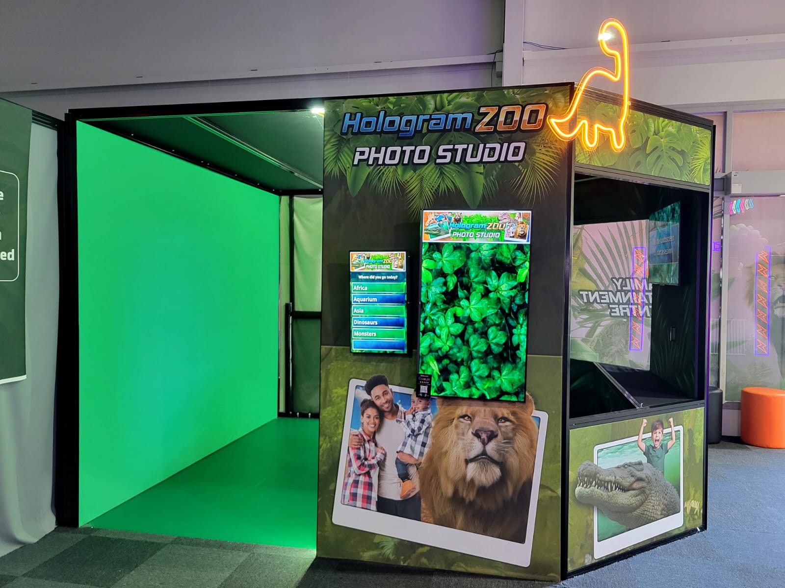 Family posing for a green-screen photo-booth shoot at another attraction